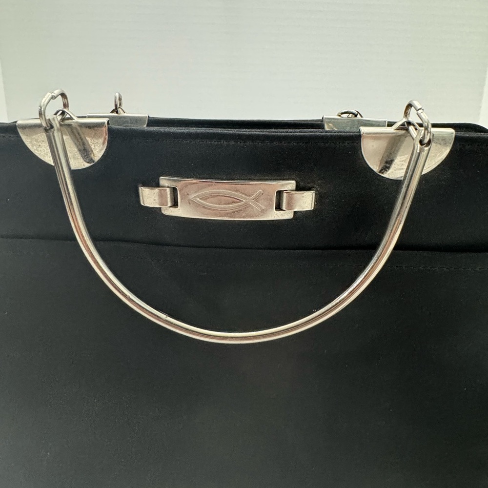 Vintage  bible carrier bag is black with a silver handle